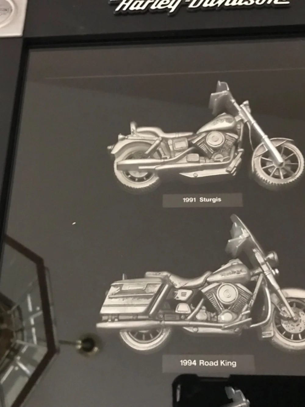 Framed Harley Davidson memorabilia